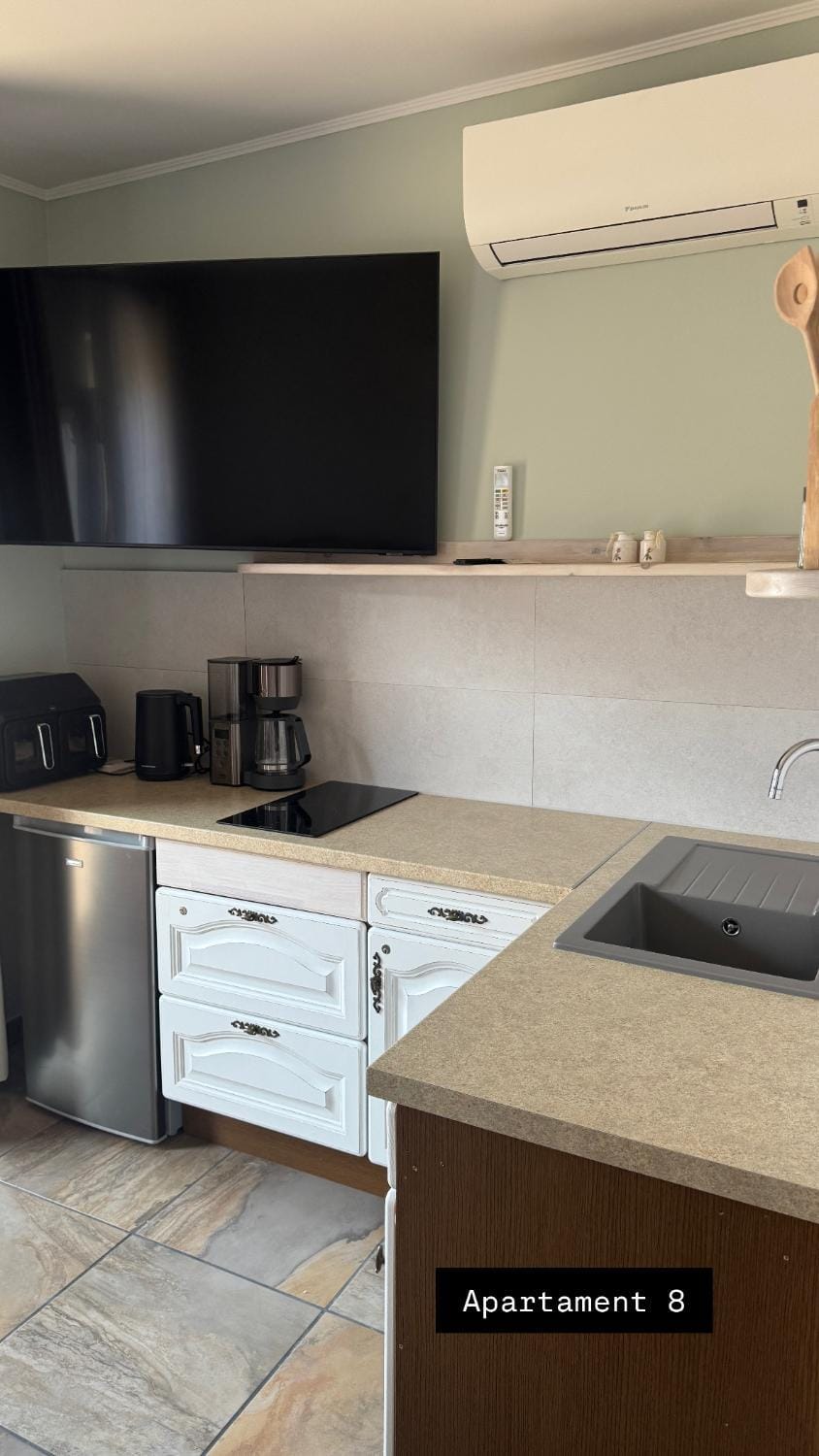 Kitchen or kitchenette, stove, air conditioner