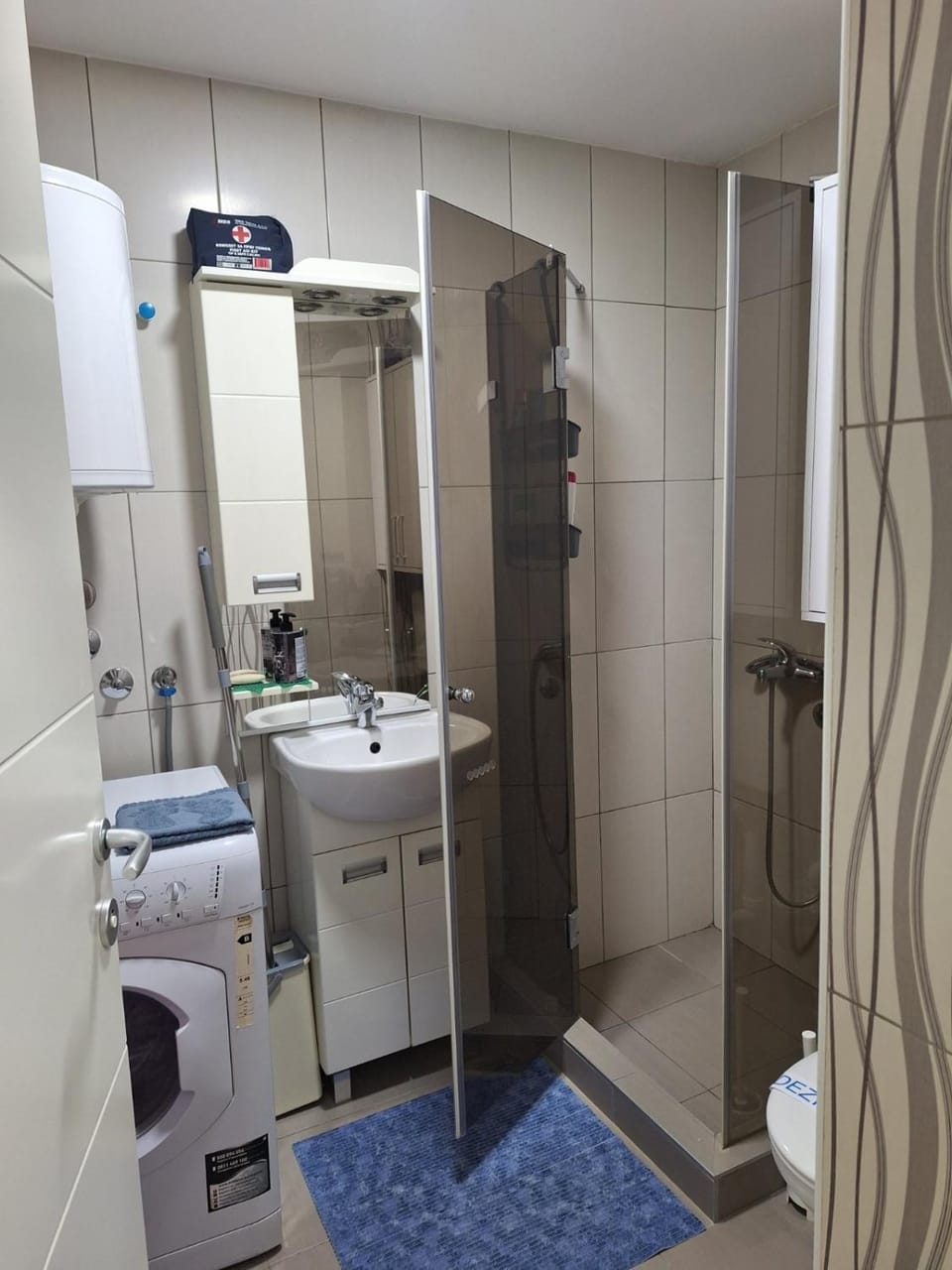 Shower, Toilet, Bathroom, towels, washing machine, dryer