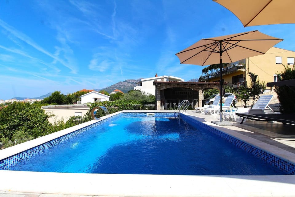 Patio, Day, Natural landscape, Pool view, Swimming pool, sunbed