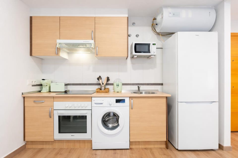 Kitchen or kitchenette, microwave, oven, stove, washing machine, kitchen