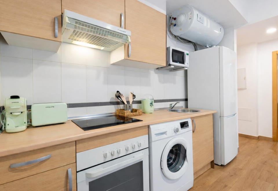Kitchen or kitchenette, oven, stove, washing machine, kitchen