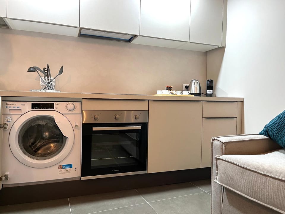 Kitchen or kitchenette, washing machine