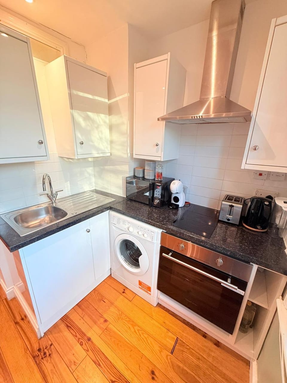 Kitchen or kitchenette, stove, toaster