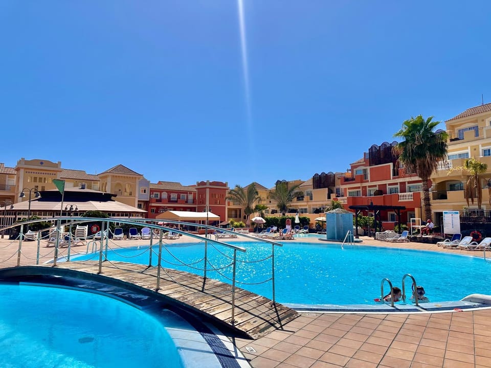 Property building, Day, Natural landscape, Pool view, Swimming pool, sunbed