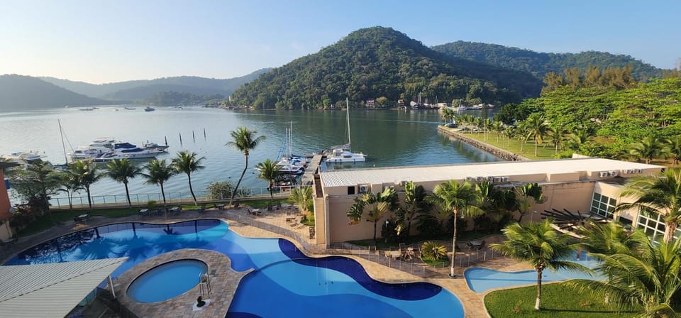Property building, Nearby landmark, Day, Natural landscape, Pool view, Swimming pool