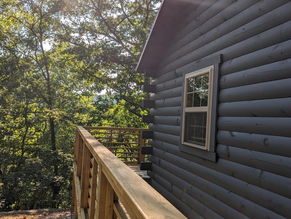 Cabin #6 with hot tub deck and sunset view at Loblolly Pines Cabin in Eureka Springs