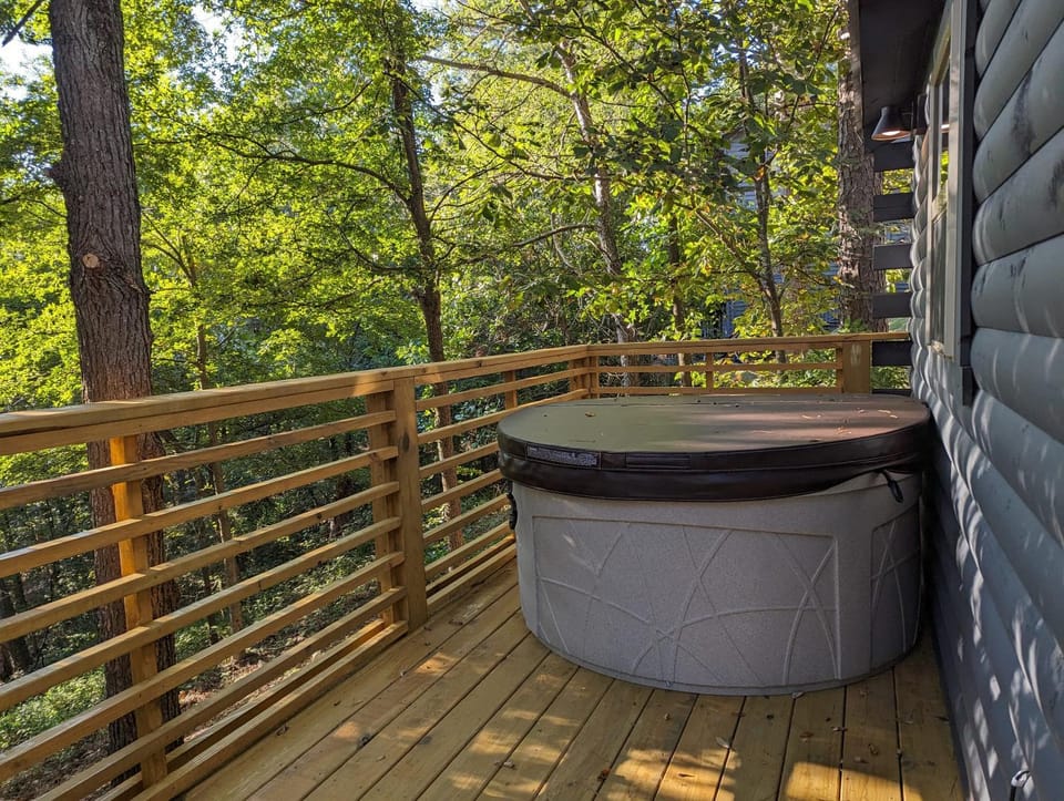 Cabin #6 with hot tub deck and sunset view at Loblolly Pines Cabin in Eureka Springs