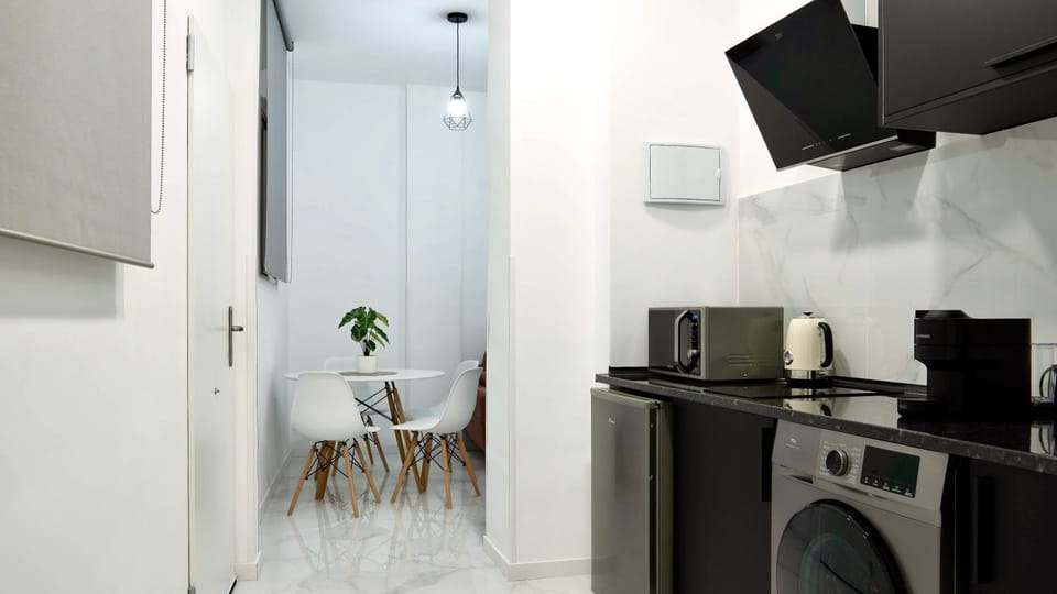 Kitchen or kitchenette, stove, washing machine