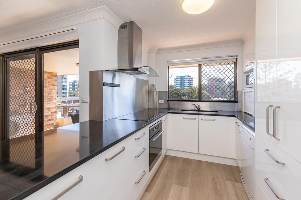 Kitchen or kitchenette, dishwasher, oven, stove