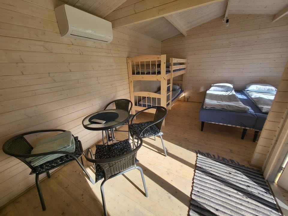 Photo of the whole room, Seating area, Bedroom, bunk bed, hair dresser, air conditioner