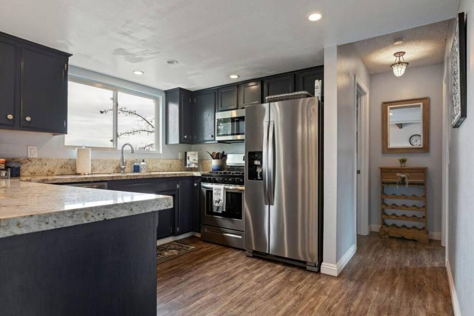Kitchen or kitchenette, dishwasher, oven, stove