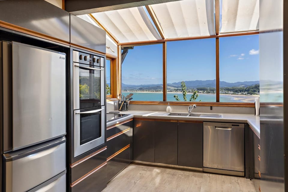 Kitchen or kitchenette, dishwasher, oven, stove