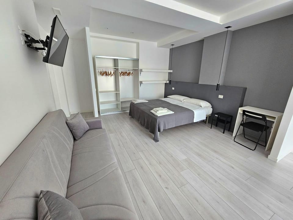 Bed, Living room, Seating area, Bedroom