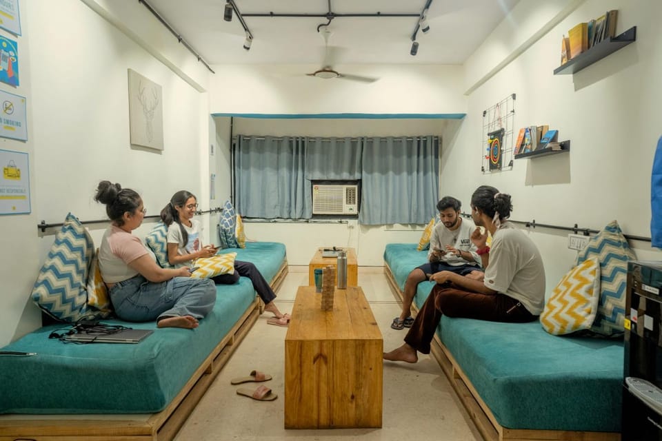 Living room, Seating area, group of guests, air conditioner