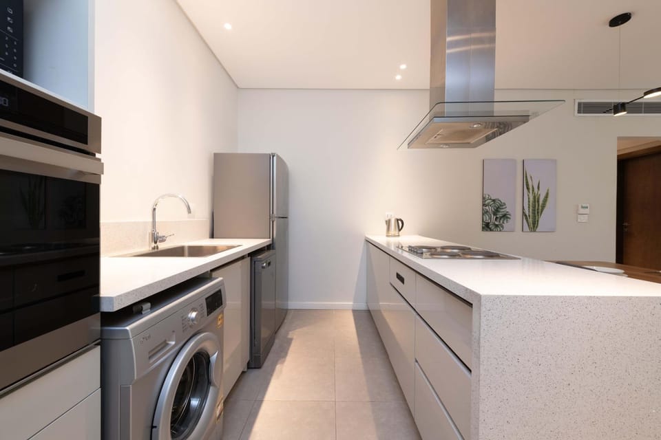 Kitchen or kitchenette, dishwasher, stove, washing machine