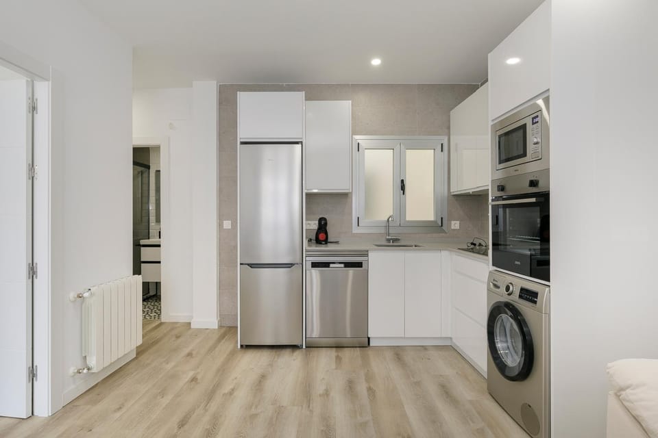 Kitchen or kitchenette, dishwasher, oven, stove, washing machine