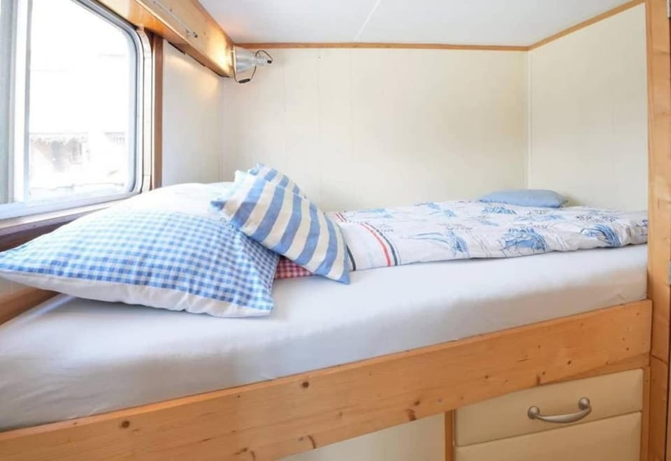 Houseboat Captain's Quarters in Harbour Amsterdam Docked boat in Amsterdam