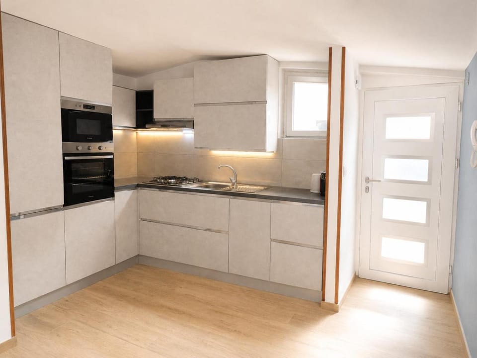 Kitchen or kitchenette, dishwasher, oven, stove