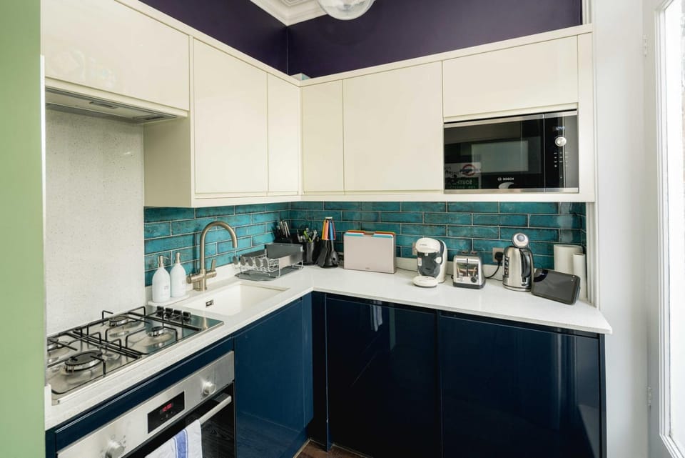 Kitchen or kitchenette, microwave, oven, stove, toaster