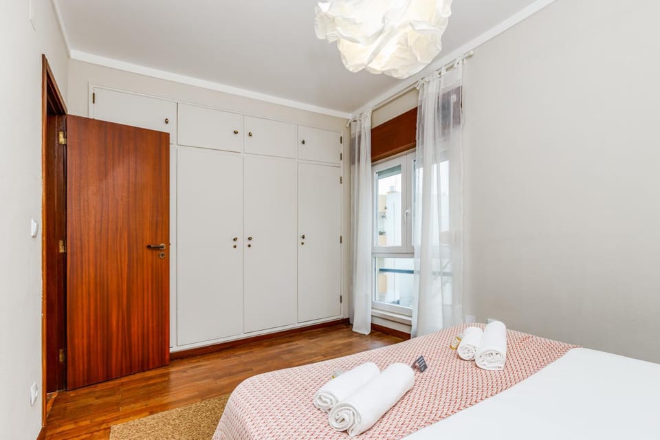Bed, towels, wardrobe