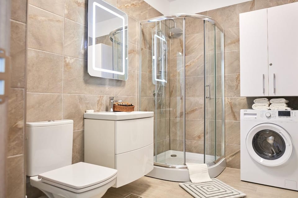 Shower, Toilet, Bathroom, towels, washing machine, dryer