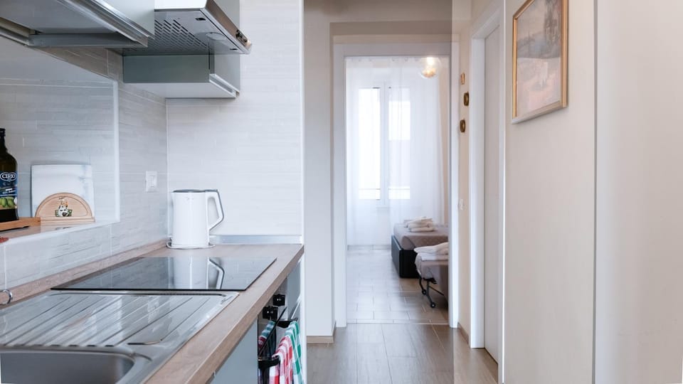 Kitchen or kitchenette, stove, air conditioner