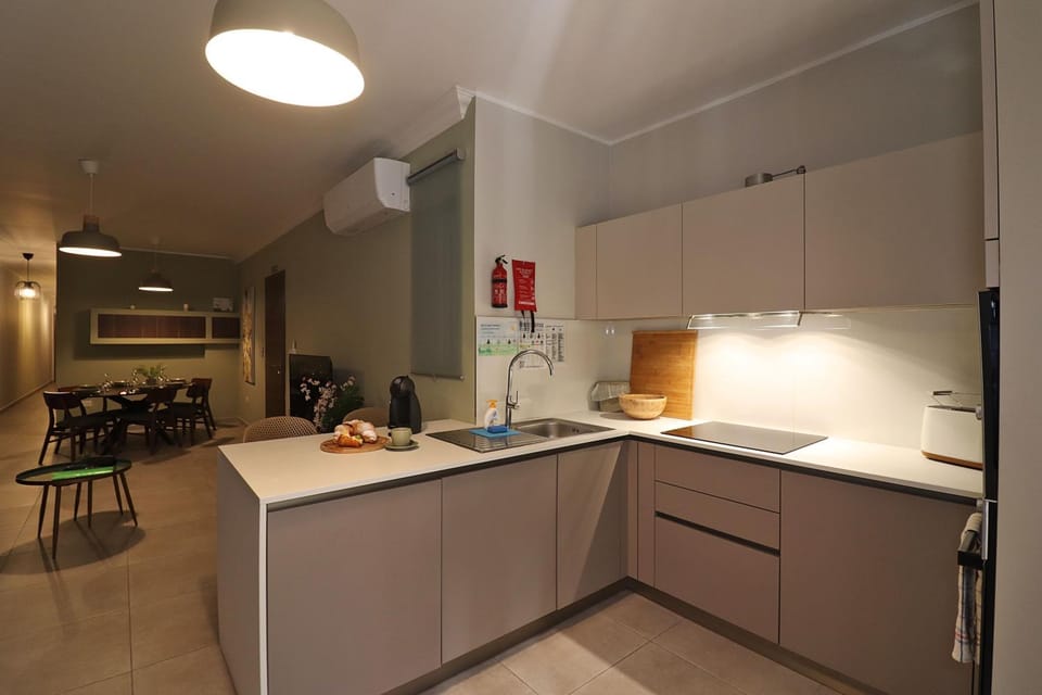 Kitchen or kitchenette, dishwasher, oven, stove
