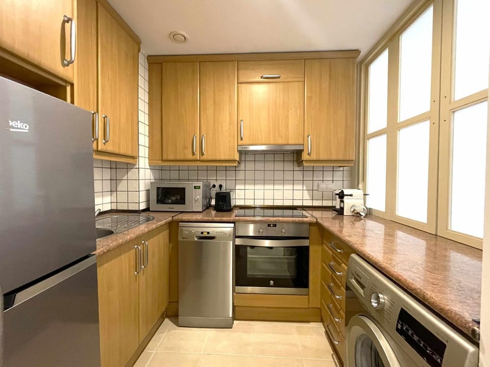 Kitchen or kitchenette, dishwasher, stove, toaster