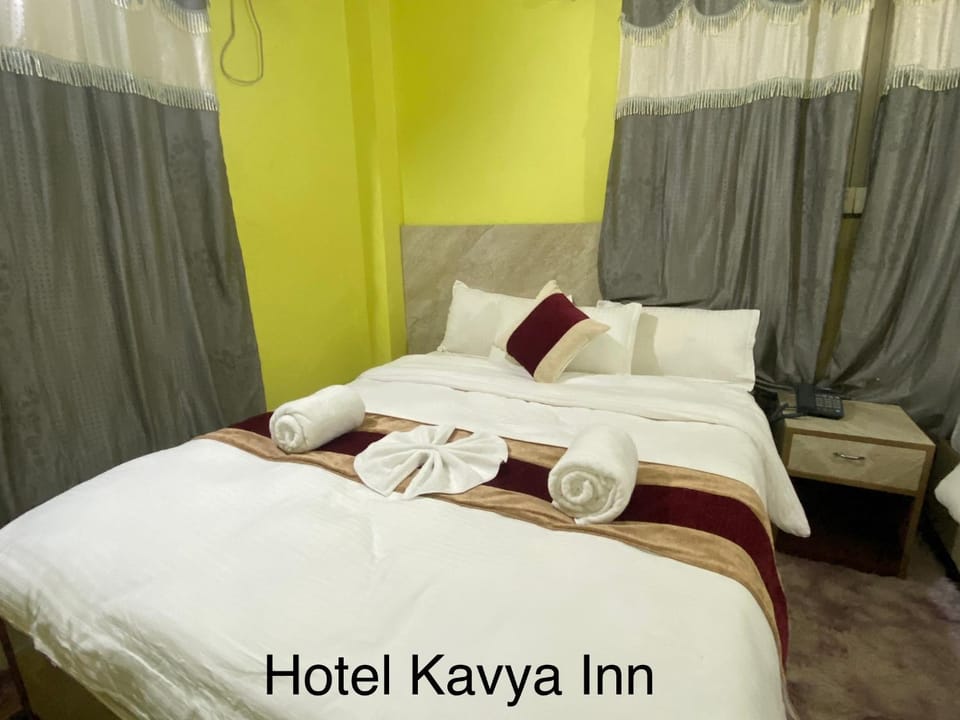 Bed, Photo of the whole room, Bedroom, Text overlay, towels