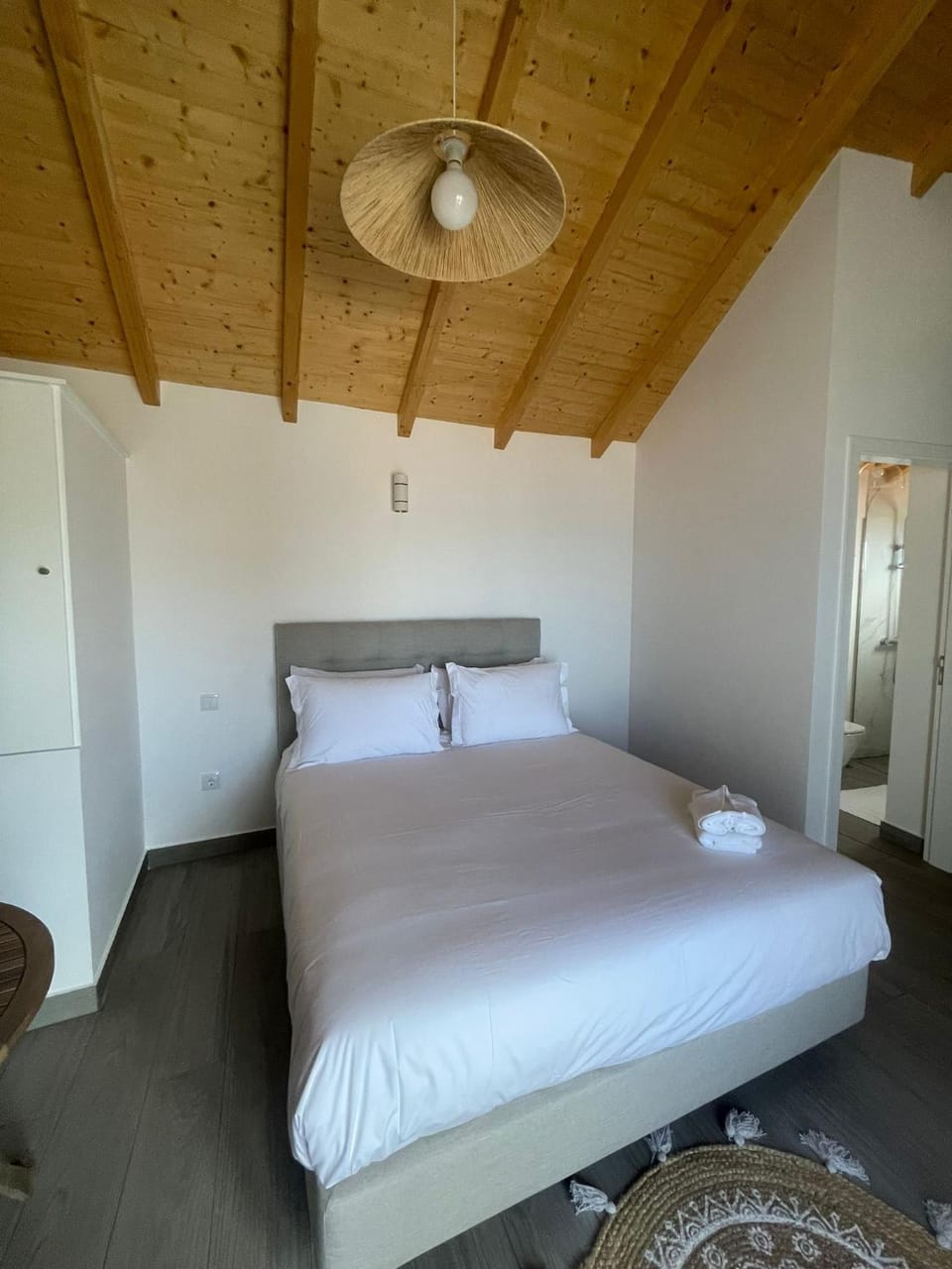 Bed, towels, wardrobe