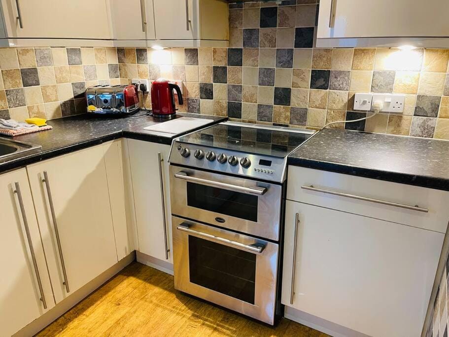 Kitchen or kitchenette, stove, toaster