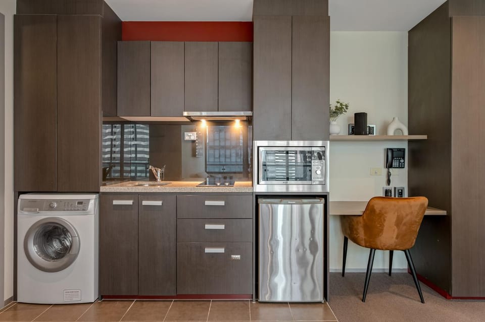 Kitchen or kitchenette, dishwasher, microwave, stove, washing machine