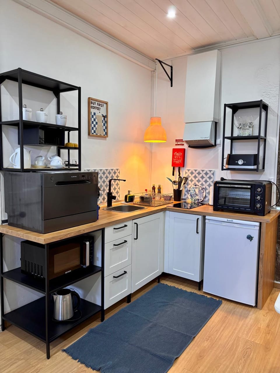 Kitchen or kitchenette, dishwasher, oven, stove
