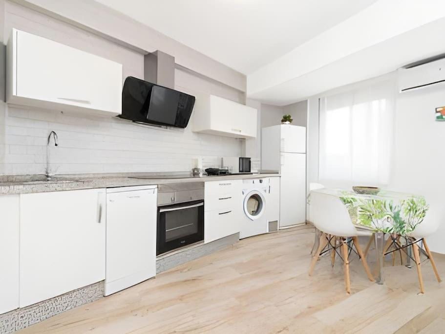 Kitchen or kitchenette, dishwasher, oven, stove, washing machine