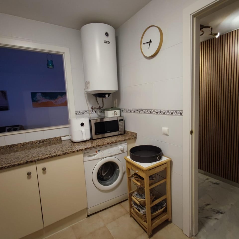 Kitchen or kitchenette, dishwasher, stove, washing machine