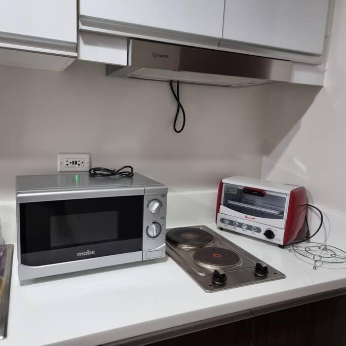 Kitchen or kitchenette, stove, toaster