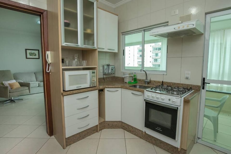 Kitchen or kitchenette, dishwasher, oven, stove