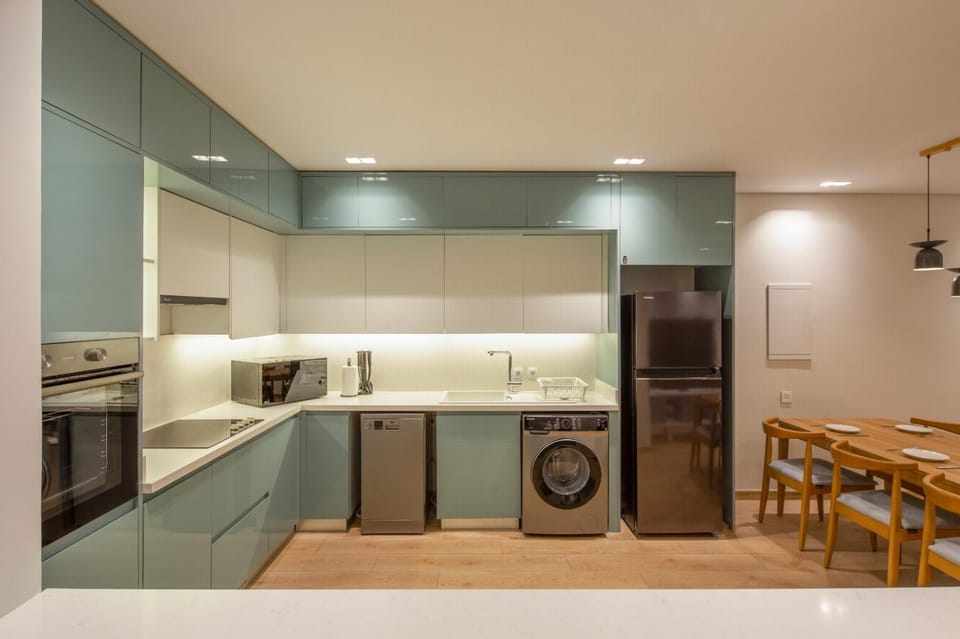 Kitchen or kitchenette, dishwasher, oven, stove, washing machine, dryer