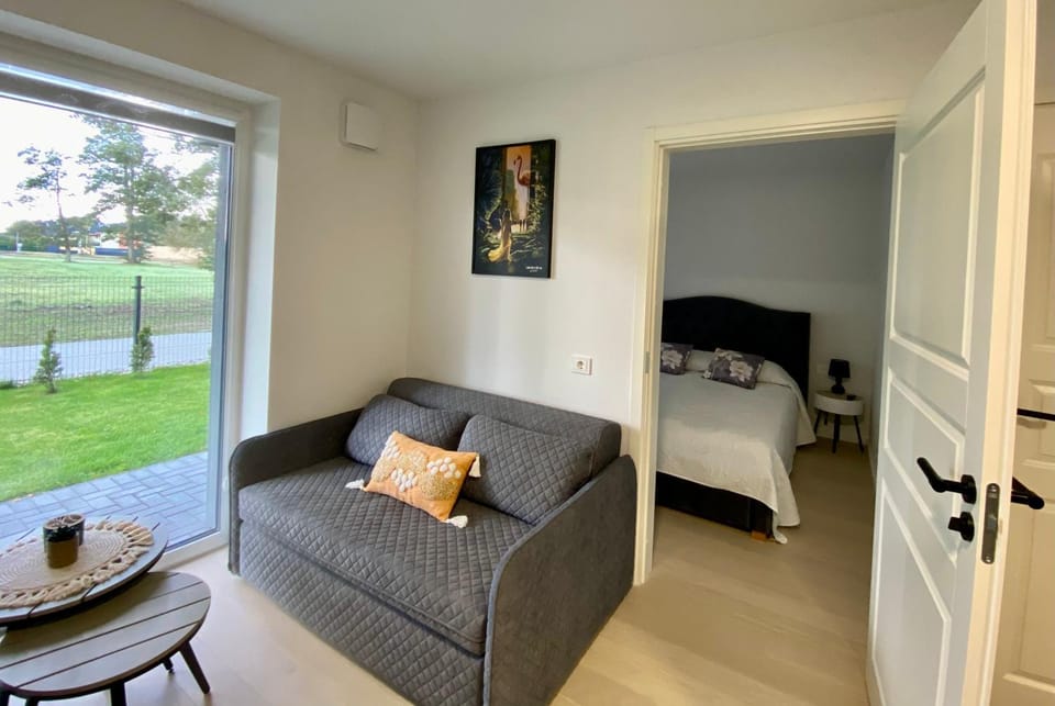 Bed, Living room, Seating area, Bedroom