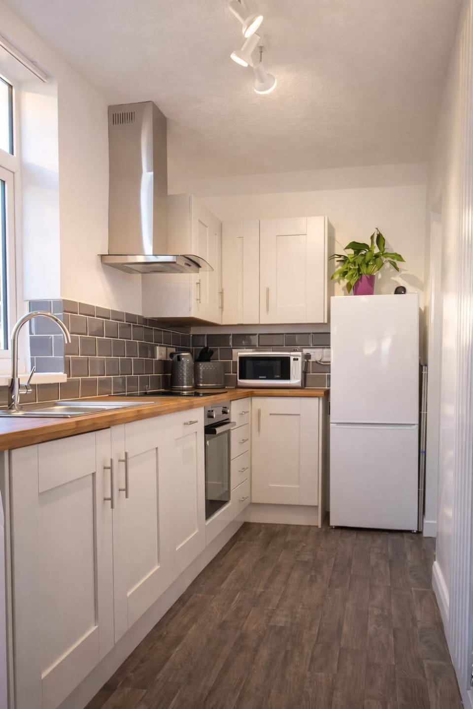 Kitchen or kitchenette, dishwasher, oven, stove