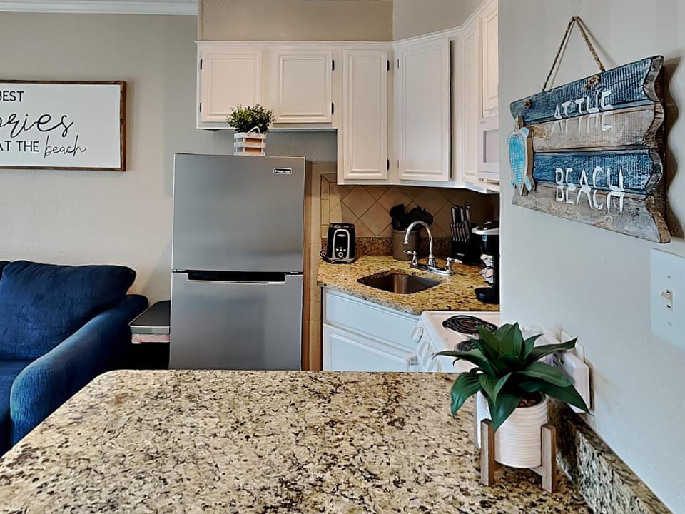 Kitchen or kitchenette, Living room, Seating area, furniture, stove