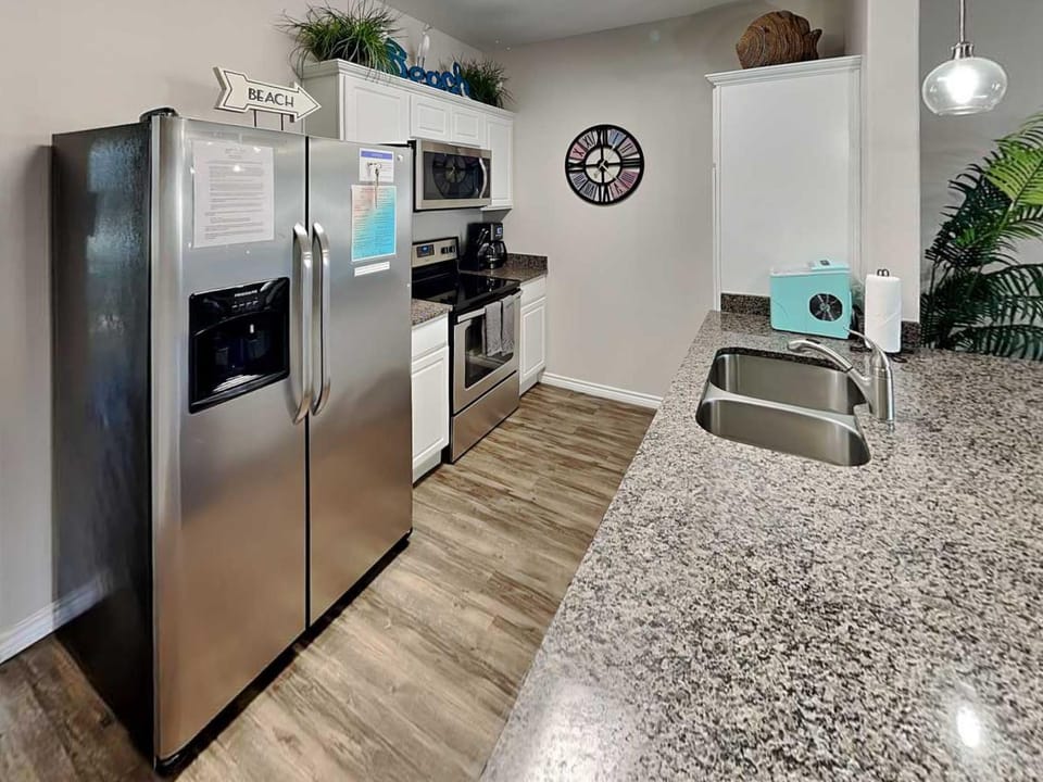 Kitchen or kitchenette, dishwasher, furniture, microwave, oven, stove, kitchen