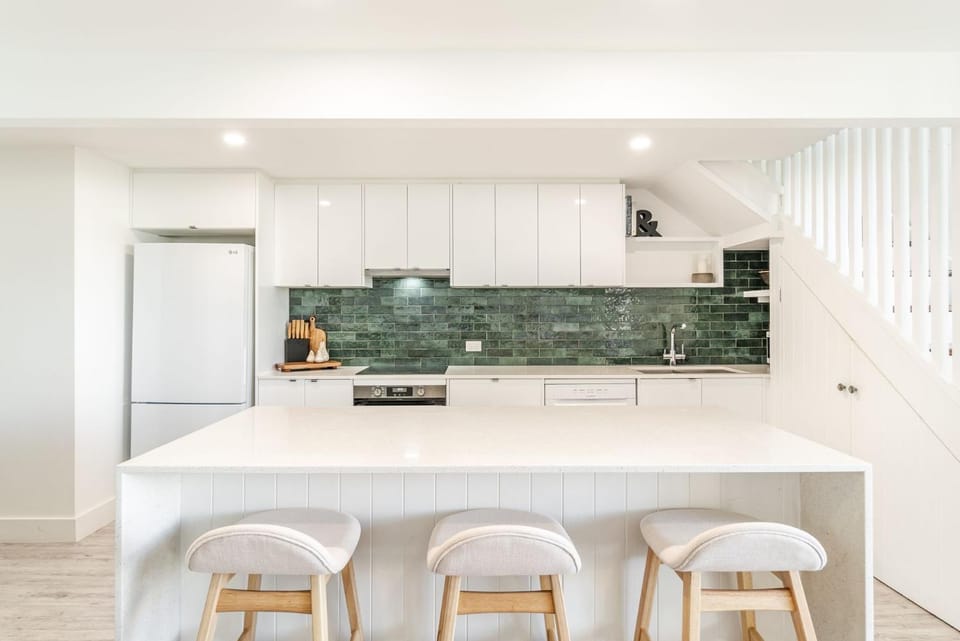 Kitchen or kitchenette, dishwasher, oven, stove