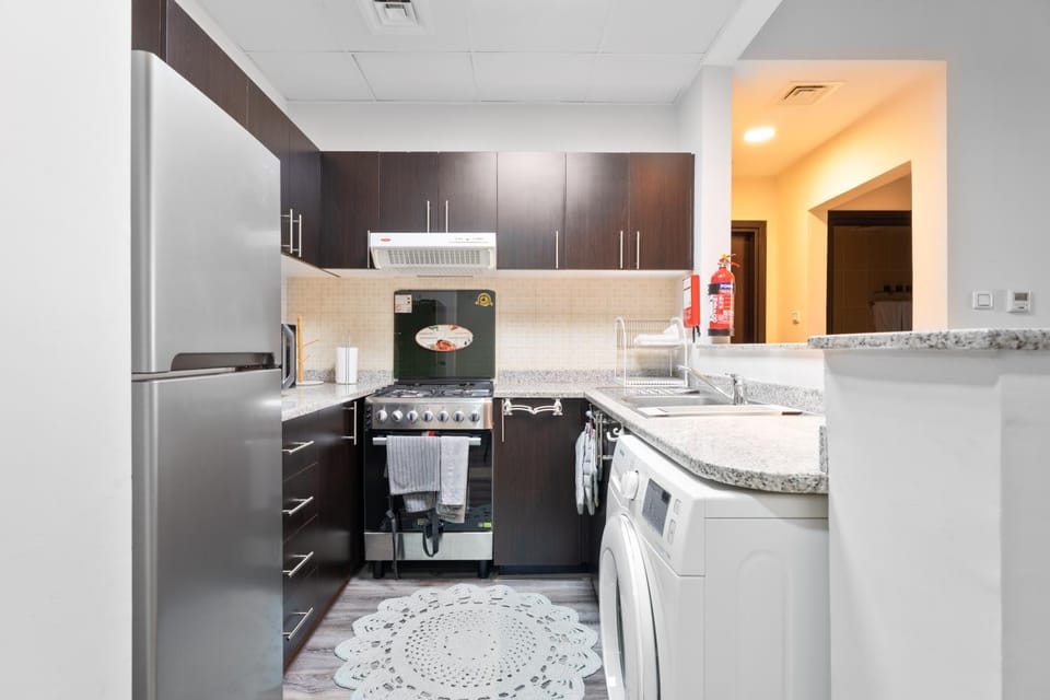 Kitchen or kitchenette, oven, stove, toaster, washing machine, dryer