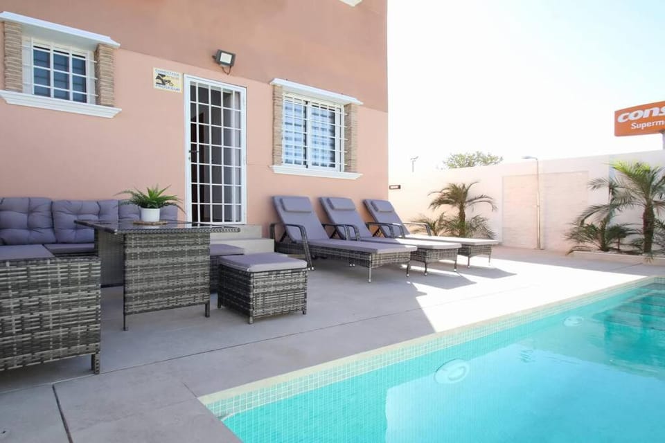 Patio, Seating area, Swimming pool, sunbed