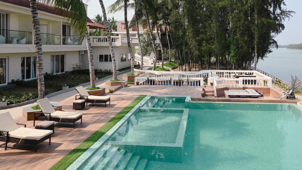 Property building, Patio, Natural landscape, Pool view, sunbed