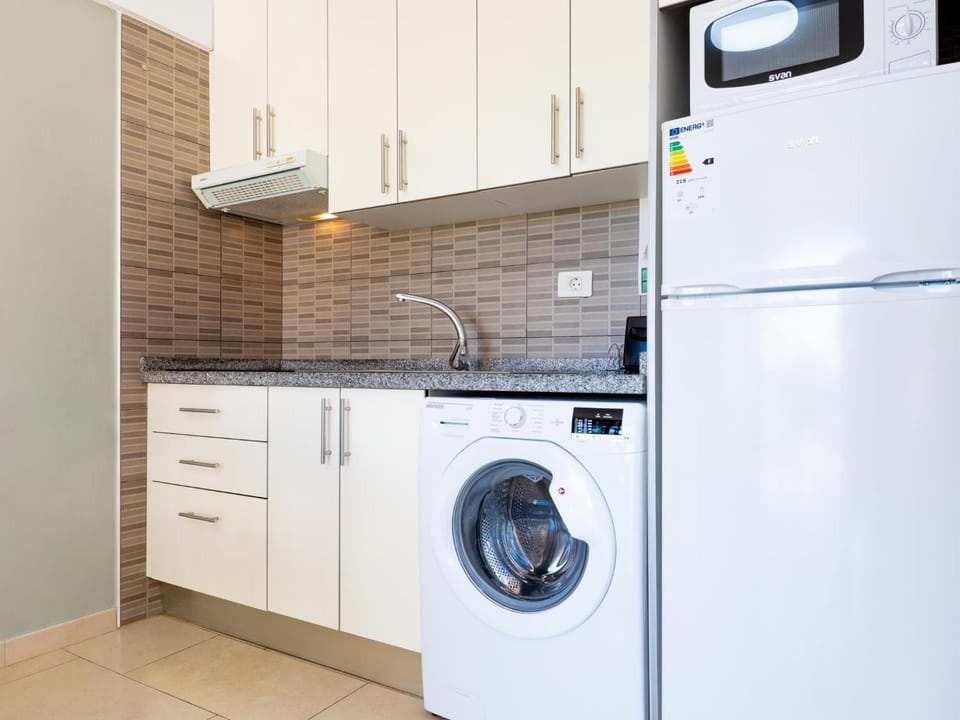Kitchen or kitchenette, washing machine