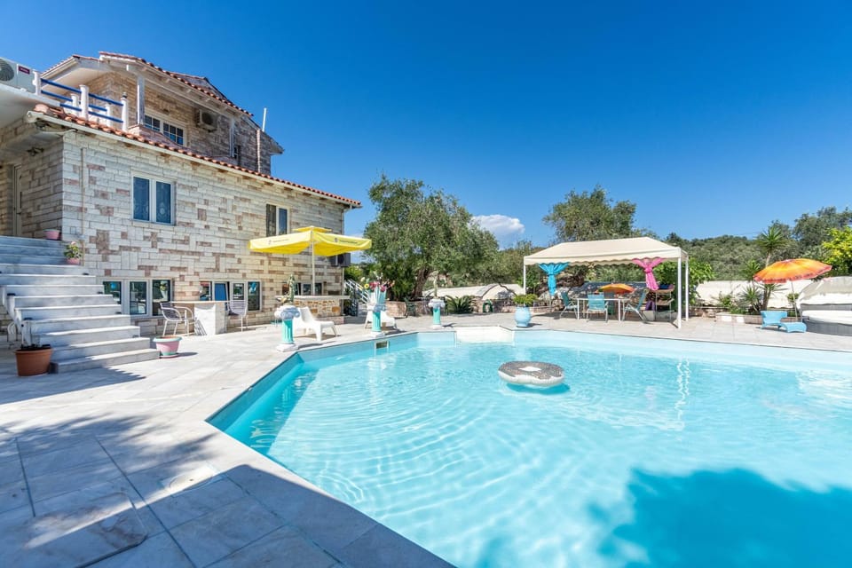 Property building, Living room, Swimming pool