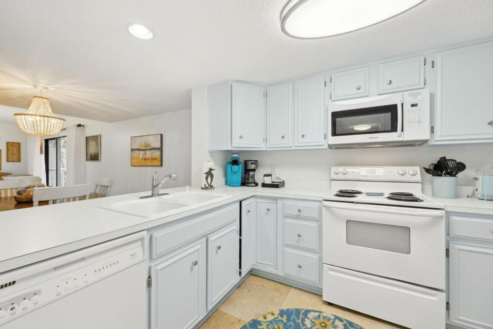 Kitchen or kitchenette, dishwasher, oven, stove