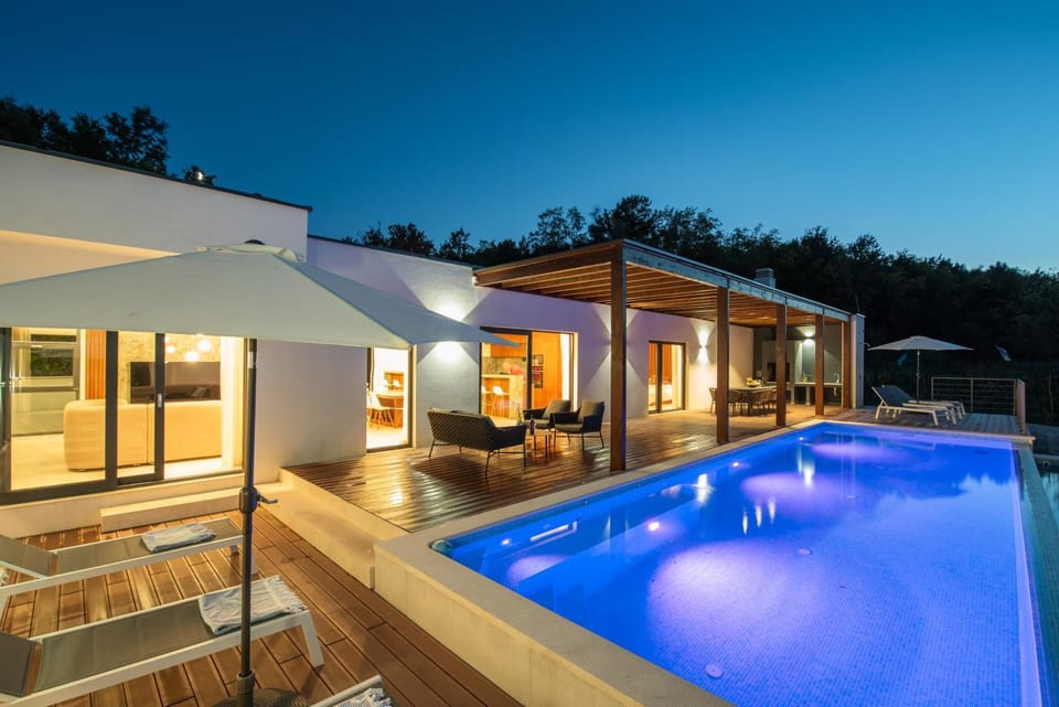 Property building, Patio, Night, Pool view, Swimming pool, sunbed